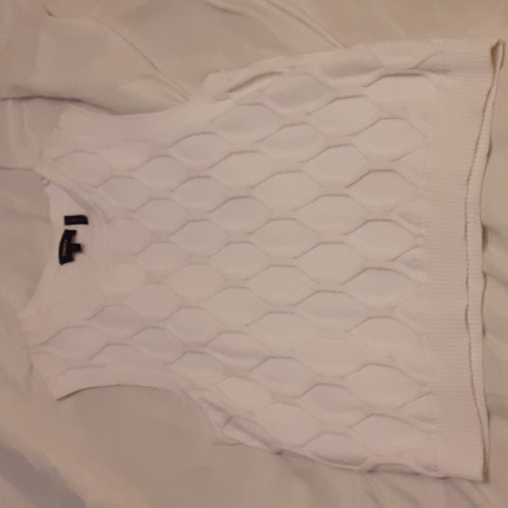 White sleeveless sweater vest